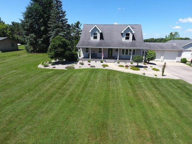 5160 Barker Rd, Jonesville, MI 49250 - new england style home featuring covered porch, a garage, a front yard, and driveway
