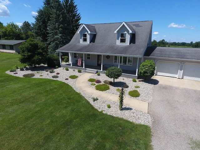 5160 Barker Rd, Jonesville, MI 49250 - view of front of property with covered porch, a garage, a front yard, and driveway