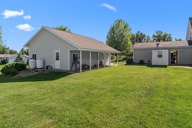 5160 Barker Rd, Jonesville, MI 49250 - back of house featuring a yard