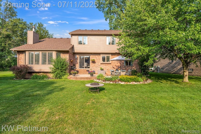 4317 Vassar Dr, Troy, MI 48085 - rear view of house featuring an outdoor fire pit, a chimney, a yard, a patio area, and brick siding