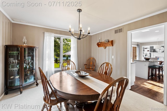 4317 Vassar Dr, Troy, MI 48085 - carpeted dining room featuring a chandelier and crown molding
