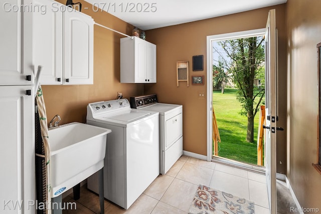 4317 Vassar Dr, Troy, MI 48085 - washroom featuring cabinet space, separate washer and dryer, and light tile patterned floors