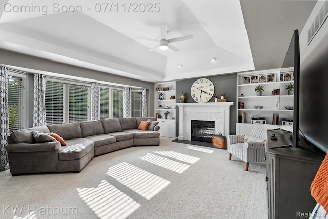 4317 Vassar Dr, Troy, MI 48085 - living room with carpet, healthy amount of natural light, built in shelves, a premium fireplace, and vaulted ceiling
