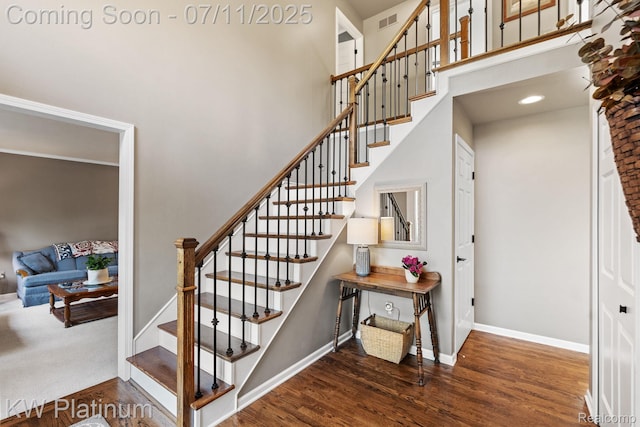 4317 Vassar Dr, Troy, MI 48085 - stairway featuring a high ceiling and wood finished floors