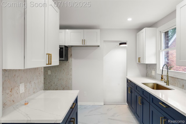 19777 Santa Rosa Dr, Detroit, MI 48221 - kitchen featuring blue cabinets, white cabinets, tasteful backsplash, stainless steel microwave, and recessed lighting