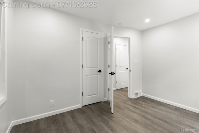 19777 Santa Rosa Dr, Detroit, MI 48221 - unfurnished room featuring dark wood-style flooring and recessed lighting