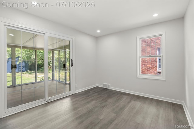 19777 Santa Rosa Dr, Detroit, MI 48221 - empty room featuring dark wood-style flooring and recessed lighting