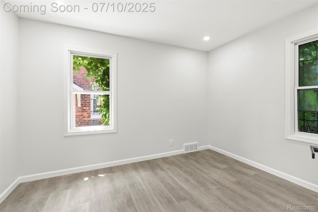 19777 Santa Rosa Dr, Detroit, MI 48221 - spare room featuring healthy amount of natural light, wood finished floors, and recessed lighting