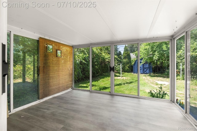 19777 Santa Rosa Dr, Detroit, MI 48221 - unfurnished sunroom featuring expansive windows, healthy amount of natural light, and wood finished floors
