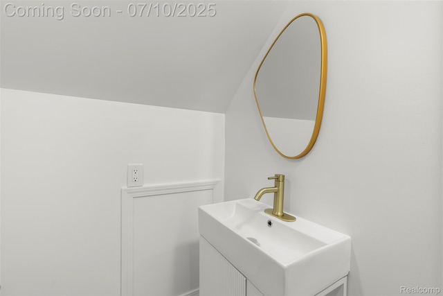 19777 Santa Rosa Dr, Detroit, MI 48221 - bathroom featuring vanity and vaulted ceiling