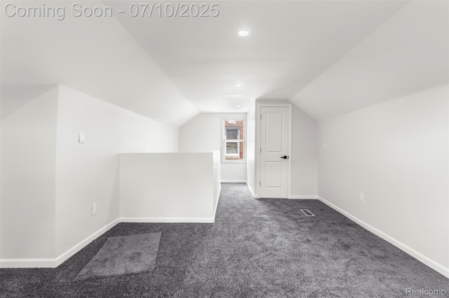 19777 Santa Rosa Dr, Detroit, MI 48221 - additional living space with dark colored carpet, vaulted ceiling, and recessed lighting