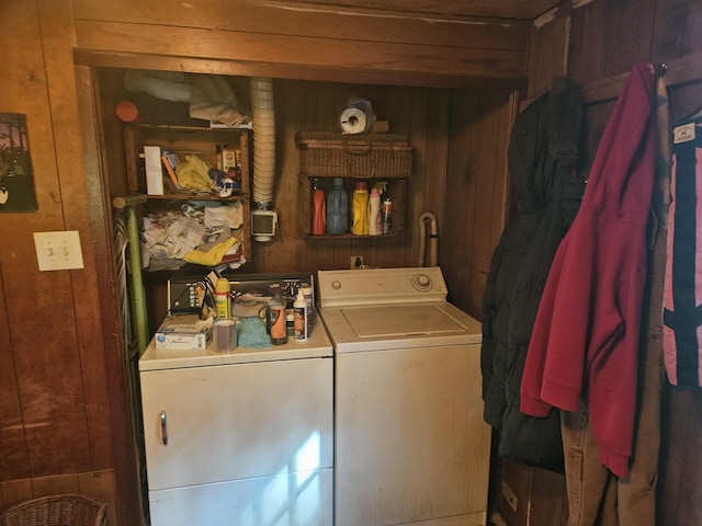 1936 W Cleveland, New Era, MI 49446 - washroom with washing machine and dryer and wooden walls