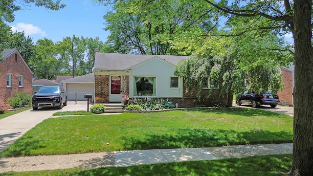 29687 Westfield St, Livonia, MI 48150 - view of front of property featuring brick siding, a front yard, and a detached garage