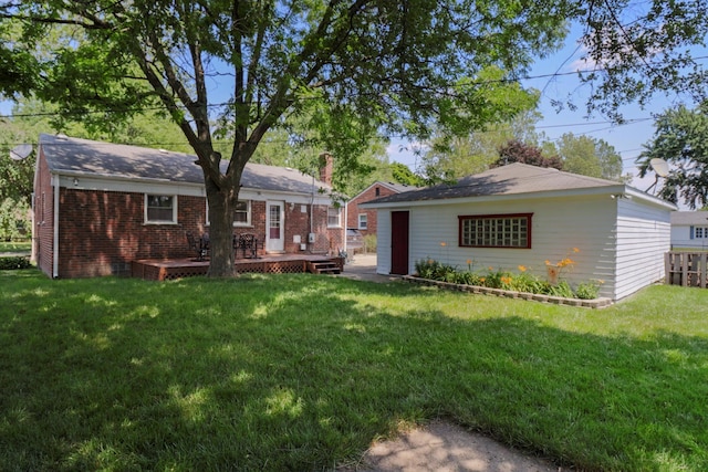 29687 Westfield St, Livonia, MI 48150 - back of property featuring a wooden deck, a yard, and brick siding