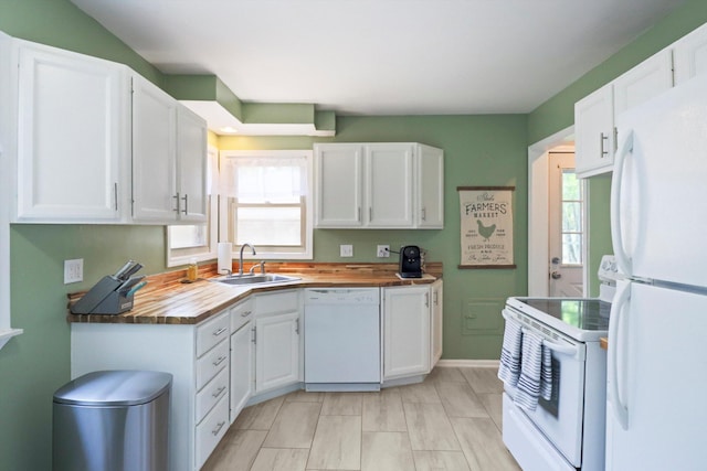 29687 Westfield St, Livonia, MI 48150 - kitchen featuring white appliances, wooden counters, plenty of natural light, and white cabinetry