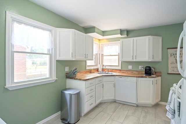 29687 Westfield St, Livonia, MI 48150 - kitchen featuring white dishwasher, butcher block counters, and white cabinets