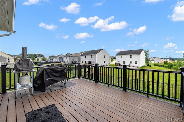 58565 Westmoore Cir, New Haven, MI 48048 - deck featuring a residential view, a yard, and grilling area