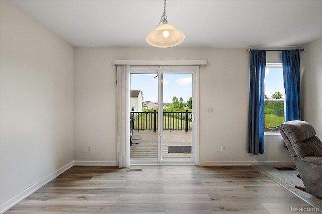 58565 Westmoore Cir, New Haven, MI 48048 - doorway with healthy amount of natural light and light wood-style floors