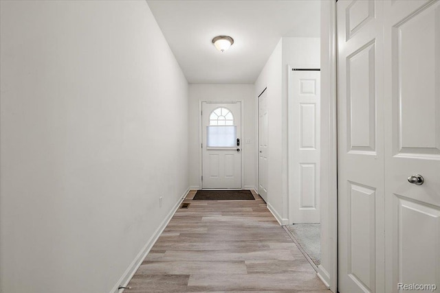 58565 Westmoore Cir, New Haven, MI 48048 - entryway featuring light wood-type flooring and baseboards