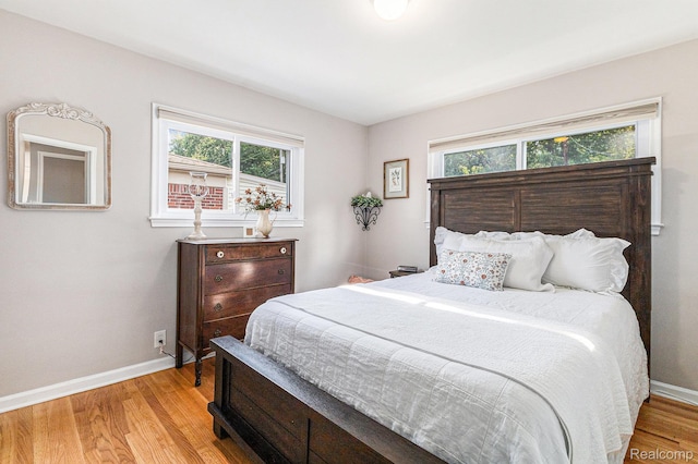 1820 W Longmeadow Rd, Trenton, MI 48183 - bedroom with baseboards and light wood-style flooring
