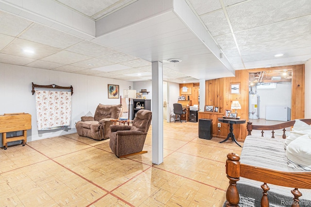 1820 W Longmeadow Rd, Trenton, MI 48183 - living area featuring gas water heater, an office area, and wood walls