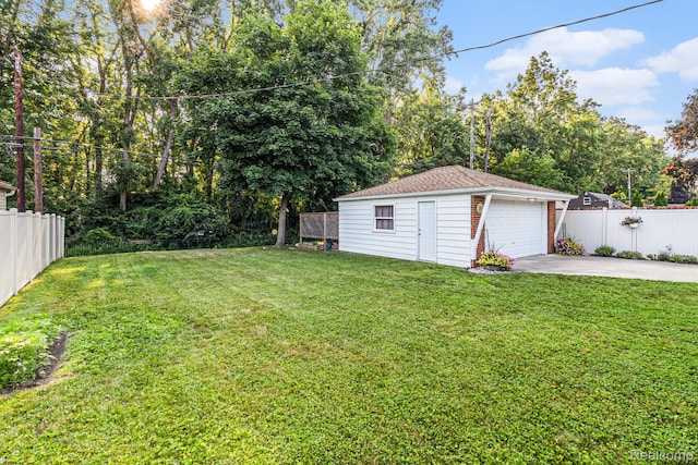 1820 W Longmeadow Rd, Trenton, MI 48183 - view of yard featuring an outdoor structure, a detached garage, and concrete driveway