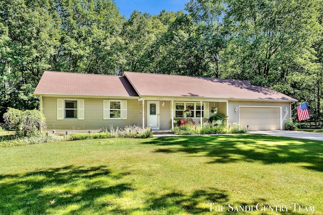 15071 Steves Dr, Grand Haven, MI 49417 - ranch-style home with an attached garage, driveway, and a front lawn