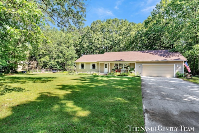 15071 Steves Dr, Grand Haven, MI 49417 - ranch-style house featuring an attached garage, concrete driveway, a front yard, and covered porch