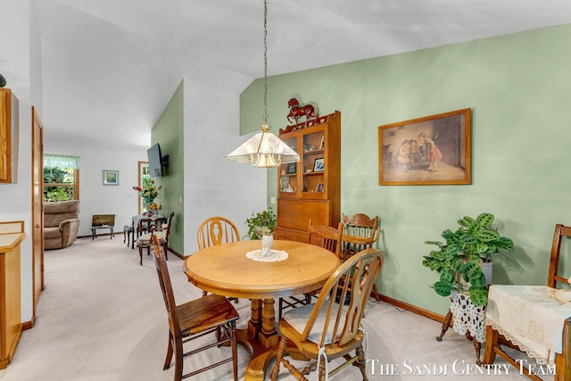 15071 Steves Dr, Grand Haven, MI 49417 - dining area with light carpet and lofted ceiling