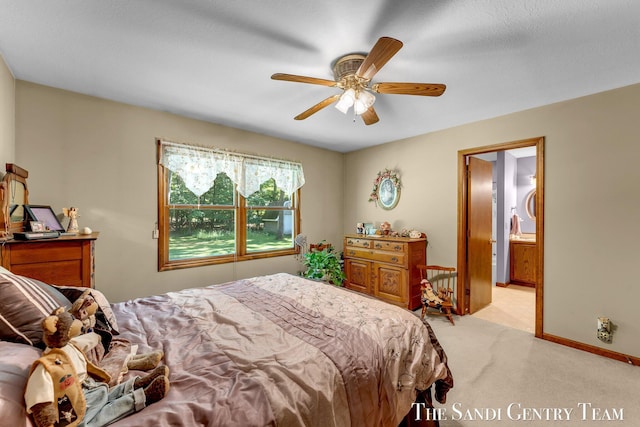 15071 Steves Dr, Grand Haven, MI 49417 - bedroom with light carpet, a ceiling fan, and ensuite bathroom
