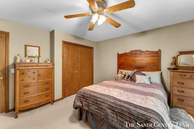 15071 Steves Dr, Grand Haven, MI 49417 - bedroom featuring light carpet, a closet, and a ceiling fan