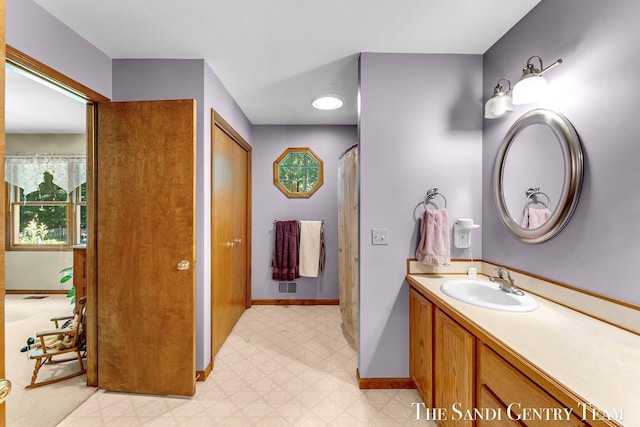15071 Steves Dr, Grand Haven, MI 49417 - bathroom with vanity and tile patterned floors