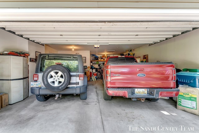 15071 Steves Dr, Grand Haven, MI 49417 - garage featuring a garage door opener