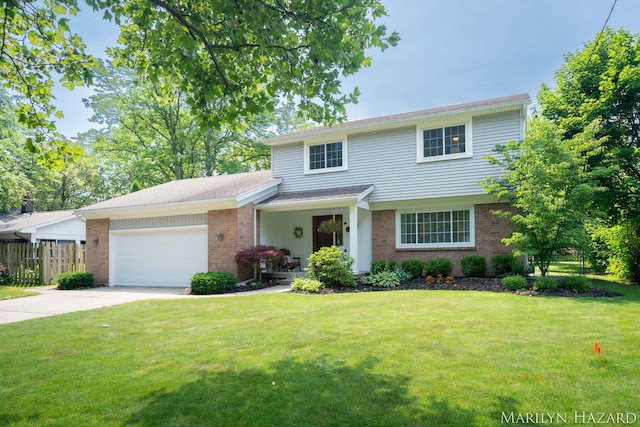 2934 Meadowbrook Dr SE, Grand Rapids, MI 49546 - view of front of property featuring brick siding, concrete driveway, and an attached garage