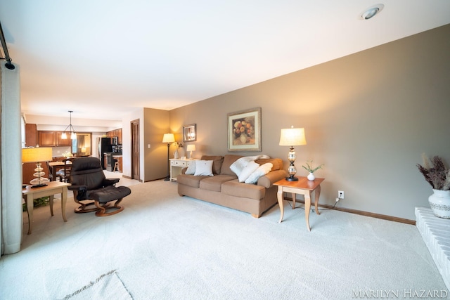 2934 Meadowbrook Dr SE, Grand Rapids, MI 49546 - living area featuring light carpet and baseboards