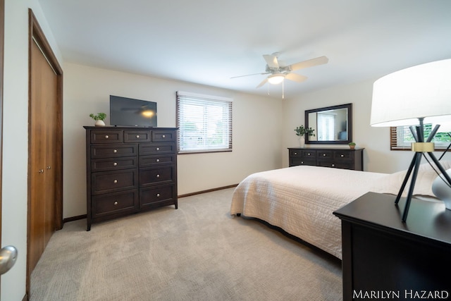 2934 Meadowbrook Dr SE, Grand Rapids, MI 49546 - bedroom with light carpet, a closet, and a ceiling fan