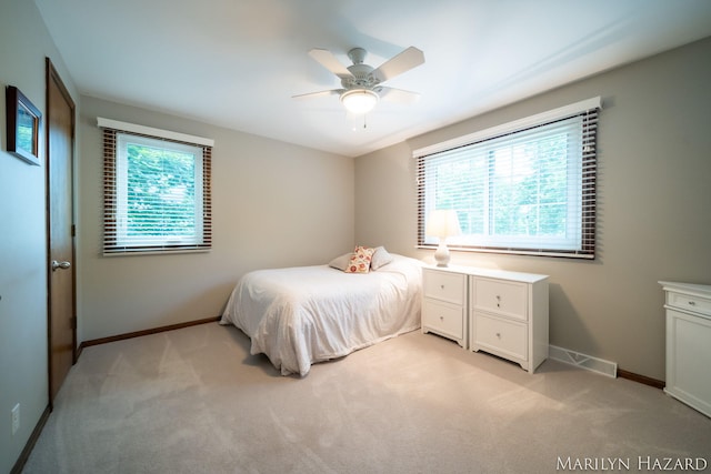 2934 Meadowbrook Dr SE, Grand Rapids, MI 49546 - bedroom with light colored carpet and a ceiling fan