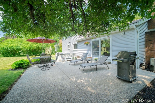 2934 Meadowbrook Dr SE, Grand Rapids, MI 49546 - view of patio / terrace with a grill, a hot tub, and outdoor dining area