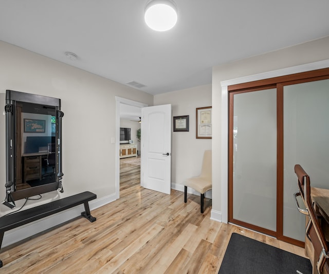 820 Barton Dr, Ann Arbor, MI 48105 - exercise room with light wood-type flooring and baseboards