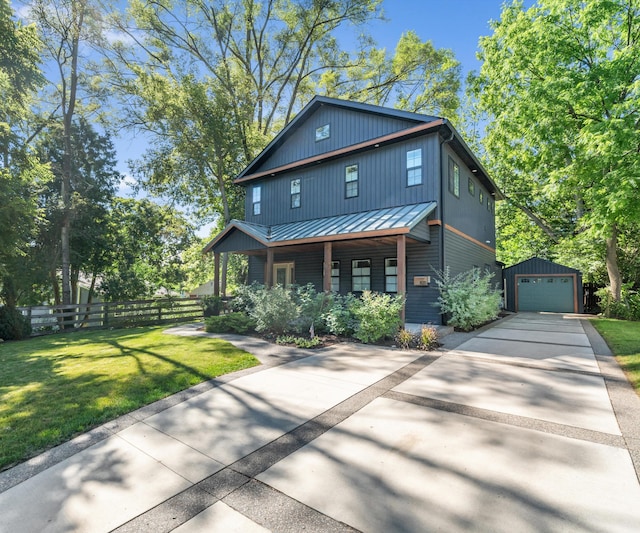 820 Barton Dr, Ann Arbor, MI 48105 - view of front of home featuring an outbuilding, a standing seam roof, driveway, covered porch, and a garage