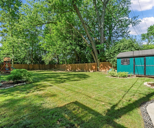 820 Barton Dr, Ann Arbor, MI 48105 - fenced backyard featuring a shed and a playground