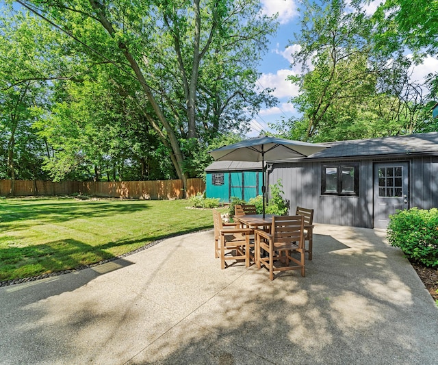 820 Barton Dr, Ann Arbor, MI 48105 - view of patio with outdoor dining area and an outdoor structure