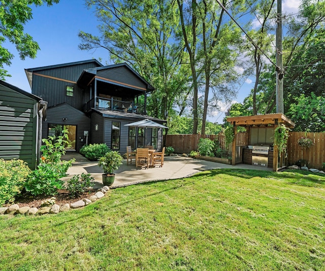 820 Barton Dr, Ann Arbor, MI 48105 - fenced backyard featuring a balcony and a patio area