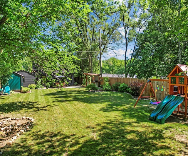 820 Barton Dr, Ann Arbor, MI 48105 - fenced backyard featuring a playground and a shed