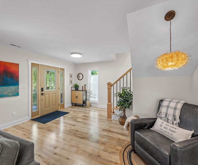 820 Barton Dr, Ann Arbor, MI 48105 - entryway with stairs and wood finished floors