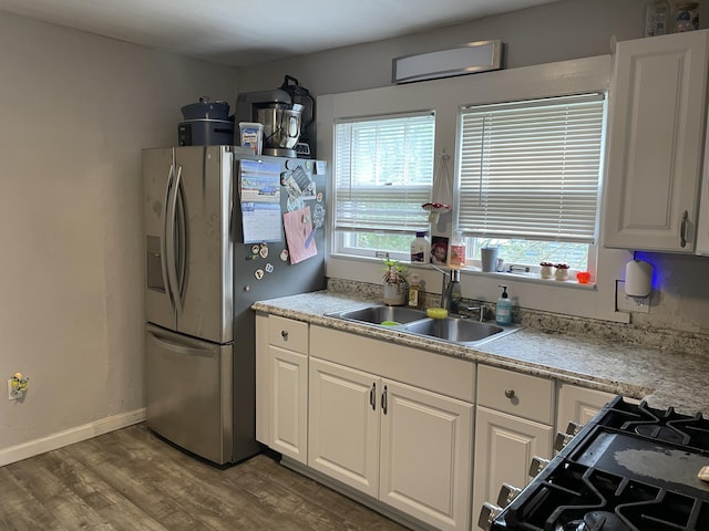33 Abbott Ave, Coldwater, MI 49036 - kitchen featuring stainless steel fridge with ice dispenser, dark wood finished floors, white cabinetry, and light countertops