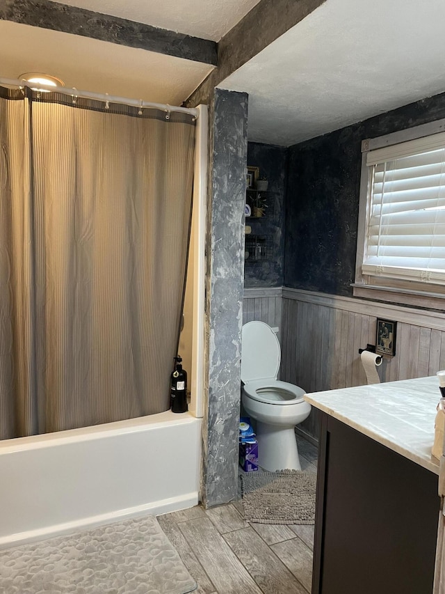 33 Abbott Ave, Coldwater, MI 49036 - full bath featuring shower / bath combo with shower curtain, vanity, wood finished floors, and a wainscoted wall