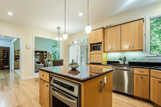 1544 Newport Creek Dr, Ann Arbor, MI 48103 - kitchen with stainless steel appliances, light wood finished floors, healthy amount of natural light, recessed lighting, and a kitchen island
