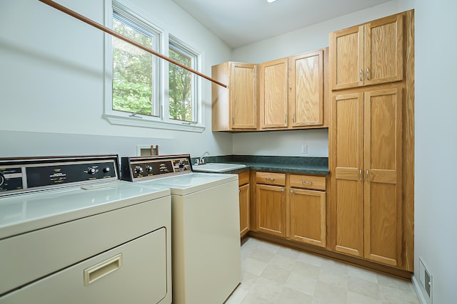 1544 Newport Creek Dr, Ann Arbor, MI 48103 - laundry room with cabinet space, washing machine and clothes dryer, and light floors