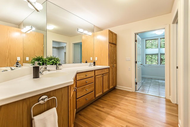 1544 Newport Creek Dr, Ann Arbor, MI 48103 - bathroom featuring double vanity and wood finished floors